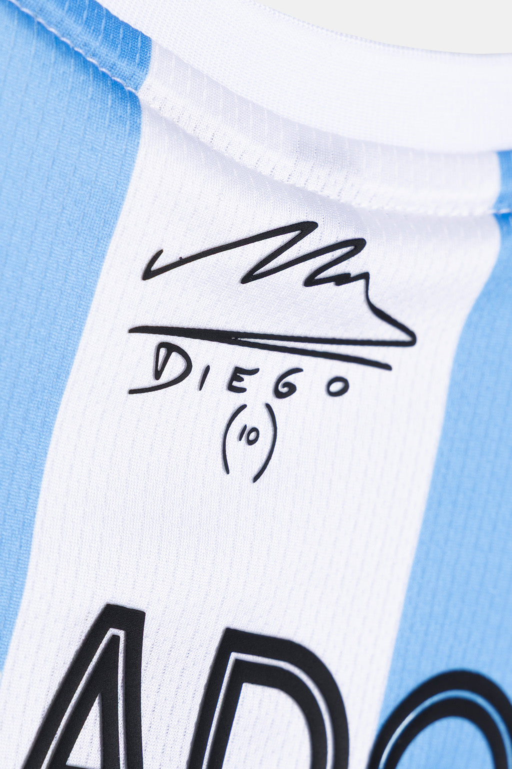 Close-up of a light blue and white striped soccer jersey with a black autograph reading 'Diego (10)' on the chest.
