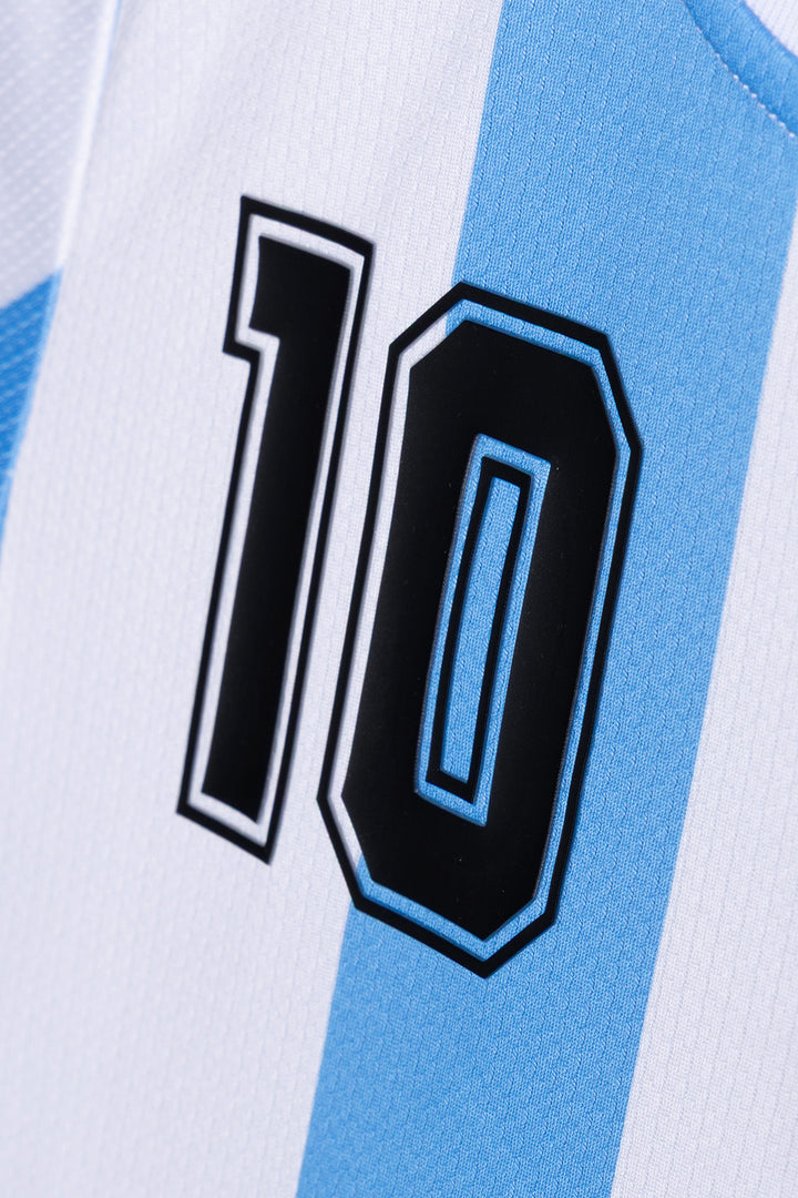 Close-up of a light blue and white striped jersey with a large black number 10 outlined in white on the front.