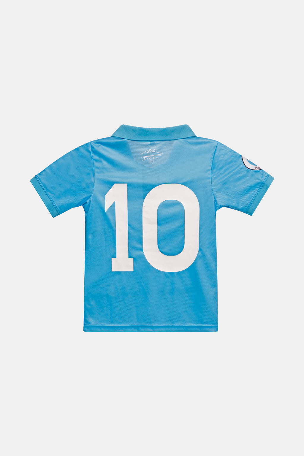 A light blue short-sleeve soccer jersey shown from the back, featuring a large white number 10 printed across the center and a small crest on the right sleeve, displayed on a light gray background.